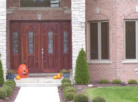 house with large entrance double wood door with sidelights