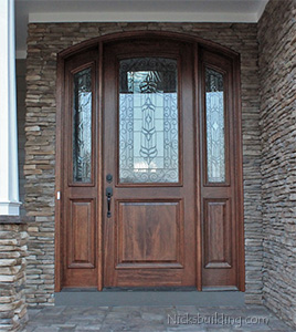 arched mahogany entry door with sidelights installation