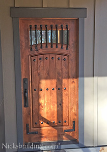 Knotty Alder exterior door with iron bars
