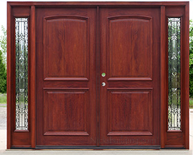 solid mahogany exterior double doors with arched panels and iron classic glass sidelites
