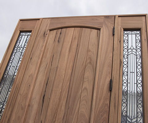 Teak wood doors showing mineral streaks