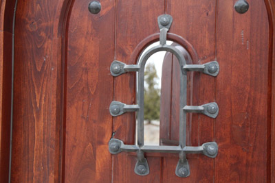 rustic arched top speakeasy door
